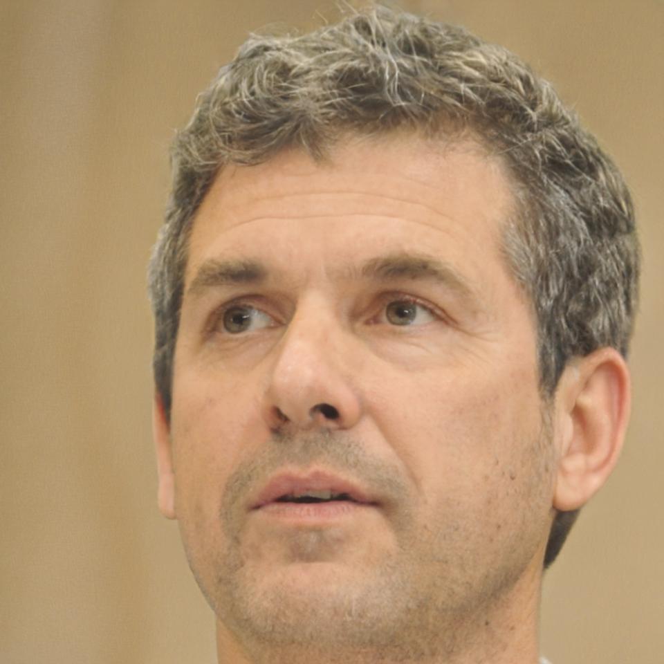 Professional headshot of financial training instructor